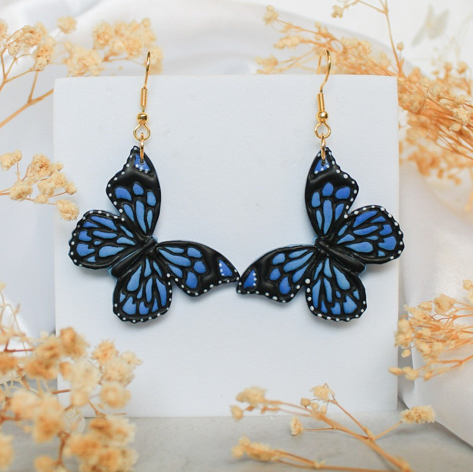 Handpainted blue butterfly polymer clay statement earrings | Shop NZ Jewellery