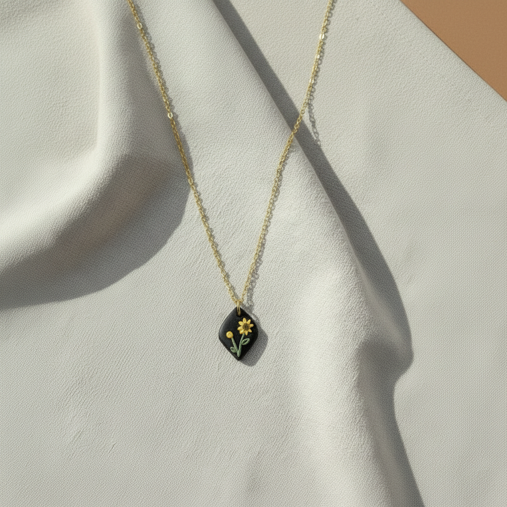 Handmade polymer clay sunflower necklace on a gold chain