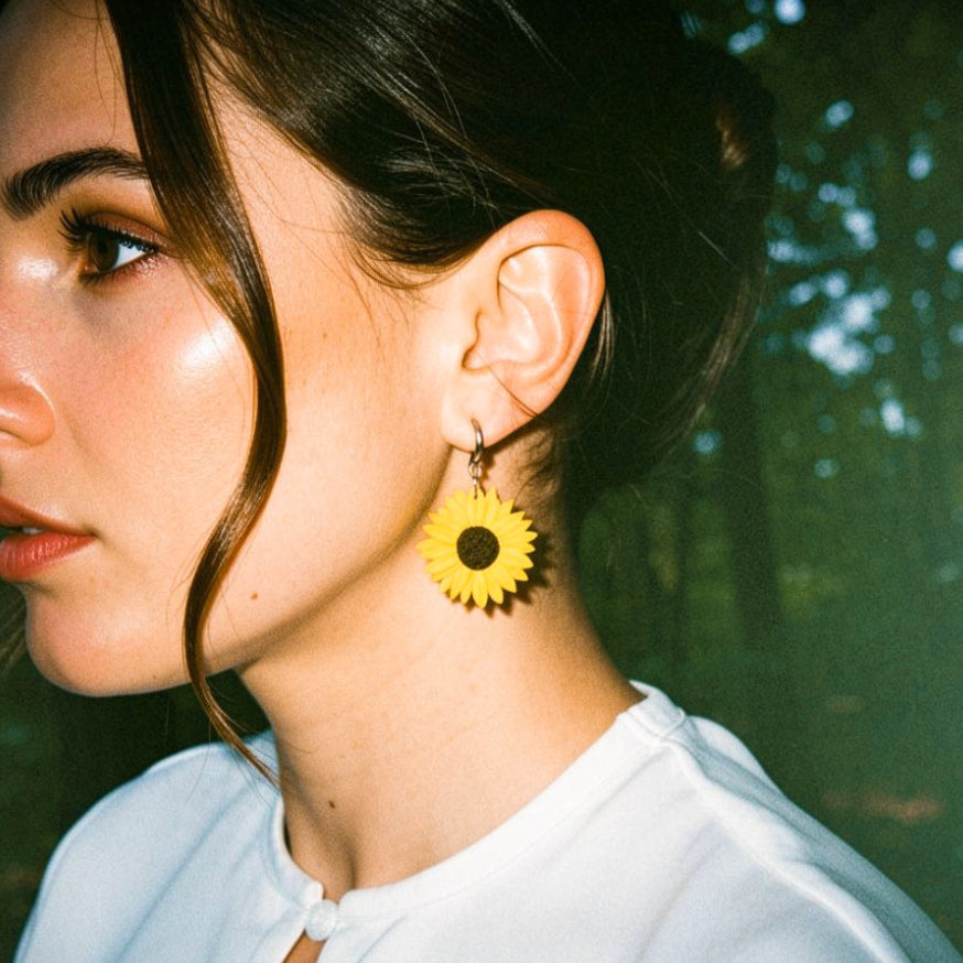 Girl wearing handmade sunflower earrings NZ