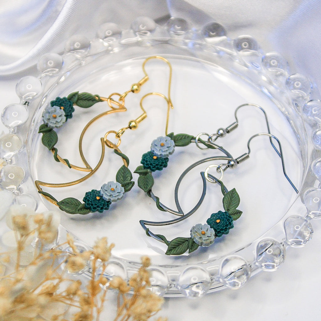 Close-up of handpainted ivy vines on gold crescent earring | handpainted earrings NZ