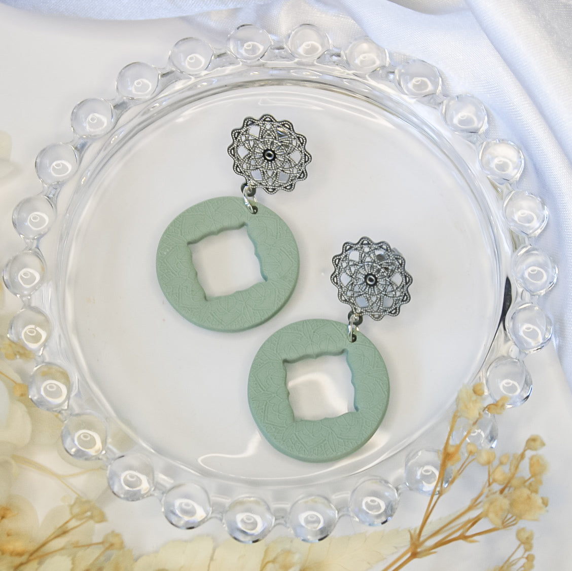 Mandala-inspired earrings – earthy sage green hue