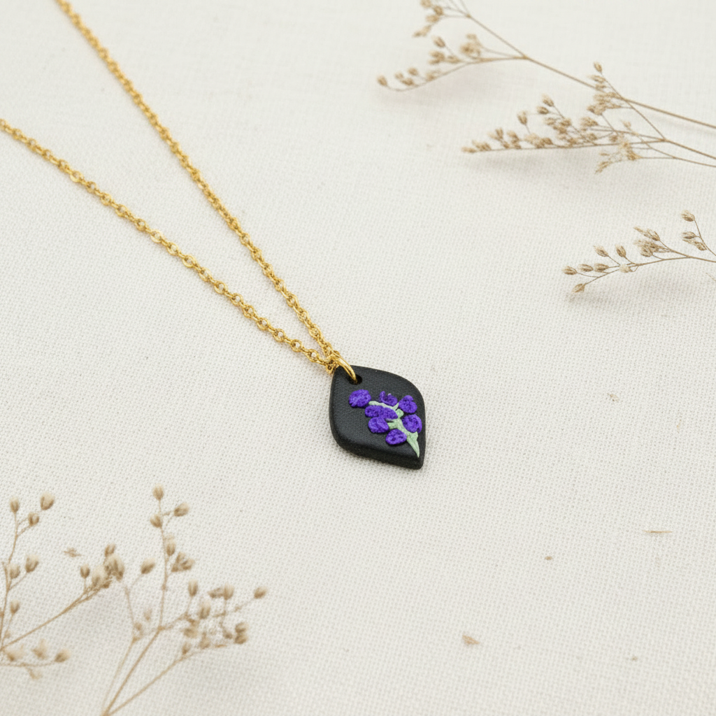 Necklace with a black pendant featuring july birth flower on a beige background