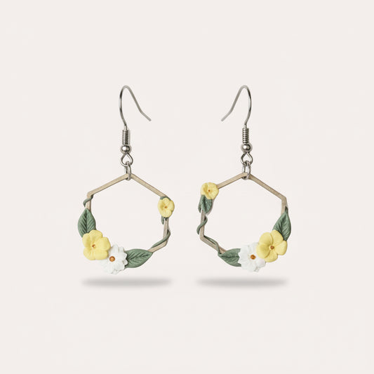silver hexagon shaped earrings with yellow and white flowers
