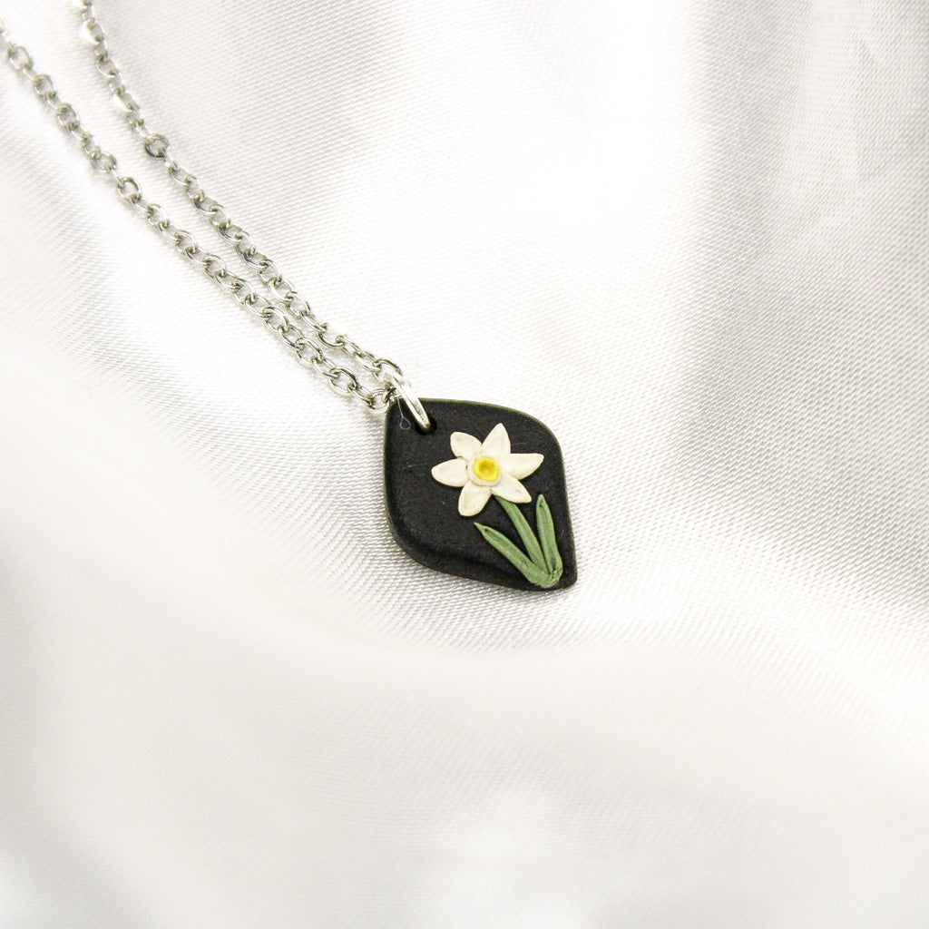 Silver raven narcissus birth flower necklace — December pendant