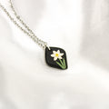 Silver raven narcissus birth flower necklace — December pendant