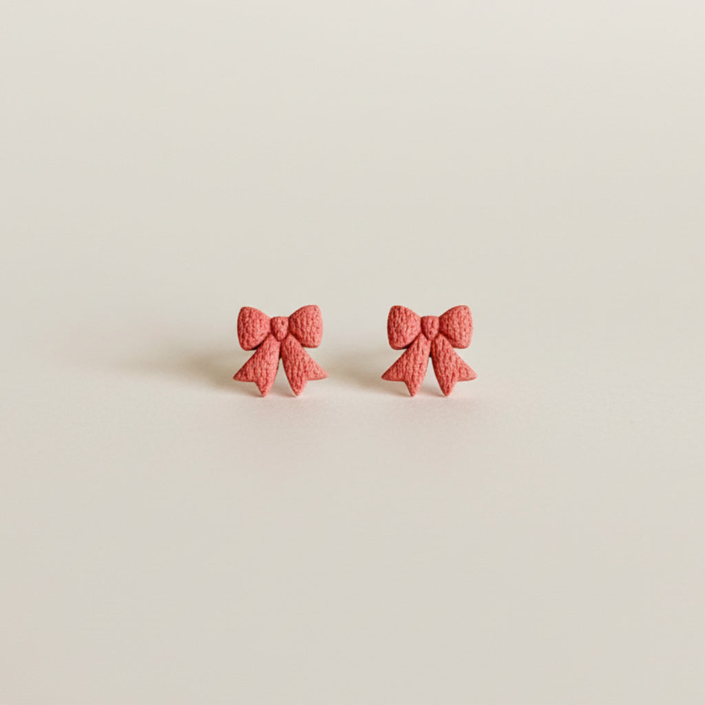 Deep blush pink mini bow shaped stud earrings