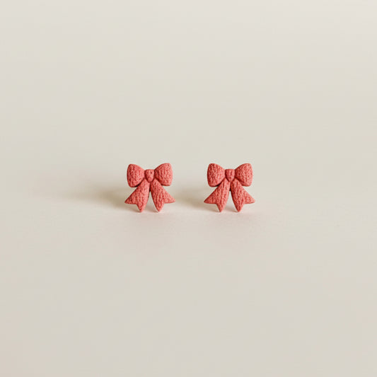 Deep blush pink mini bow shaped stud earrings