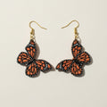 Handpainted monarch butterfly polymer clay earrings in gold | handpainted earrings NZ