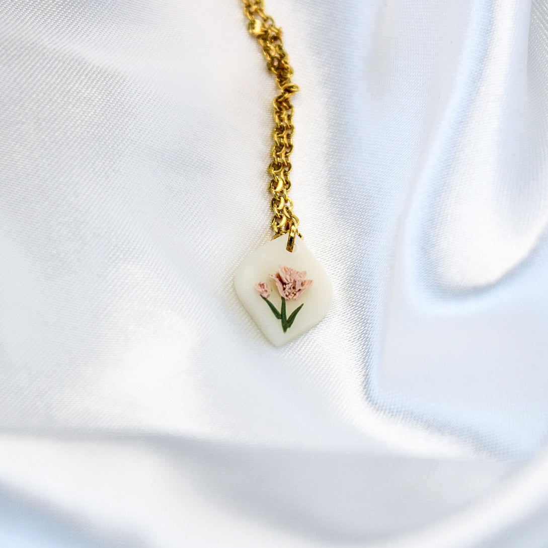 Gold carnation birth flower necklace — January pendant