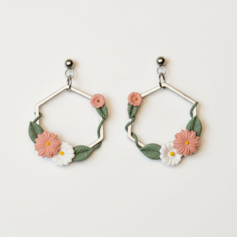 Pair of floral hoop earrings on a light background