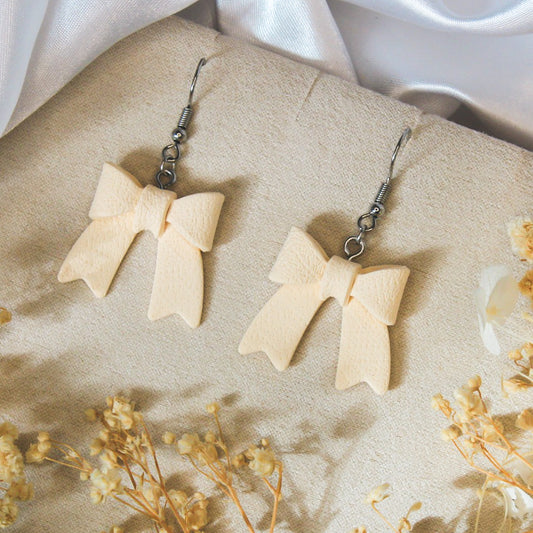 Ivory Bow Statement Earrings